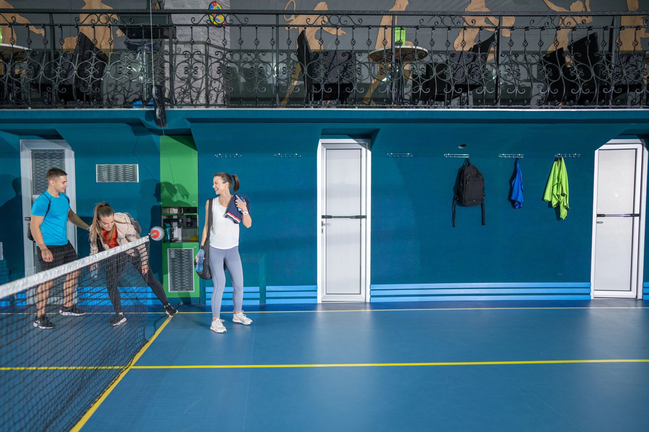 Friends entering a sports hall ready for training