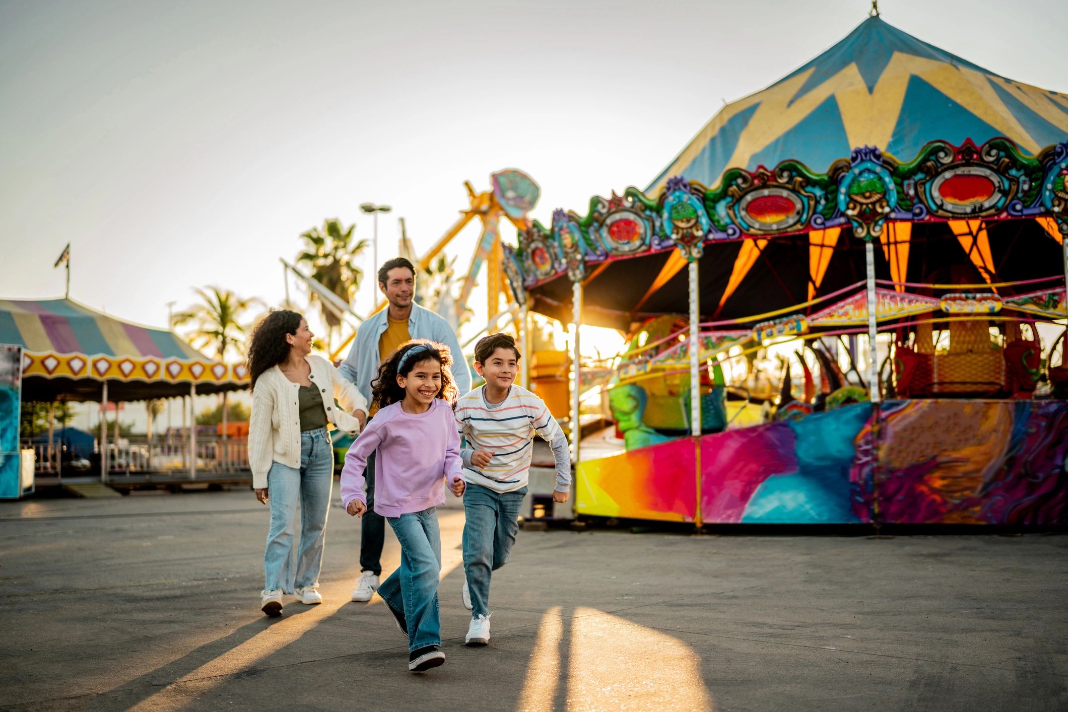 Children running at an amusement park