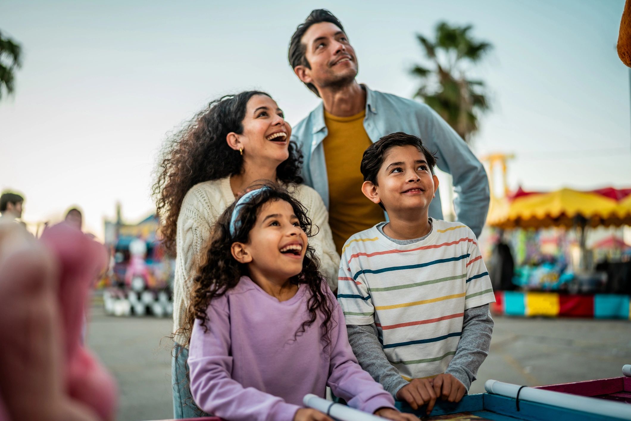Family playing a carnival booth game