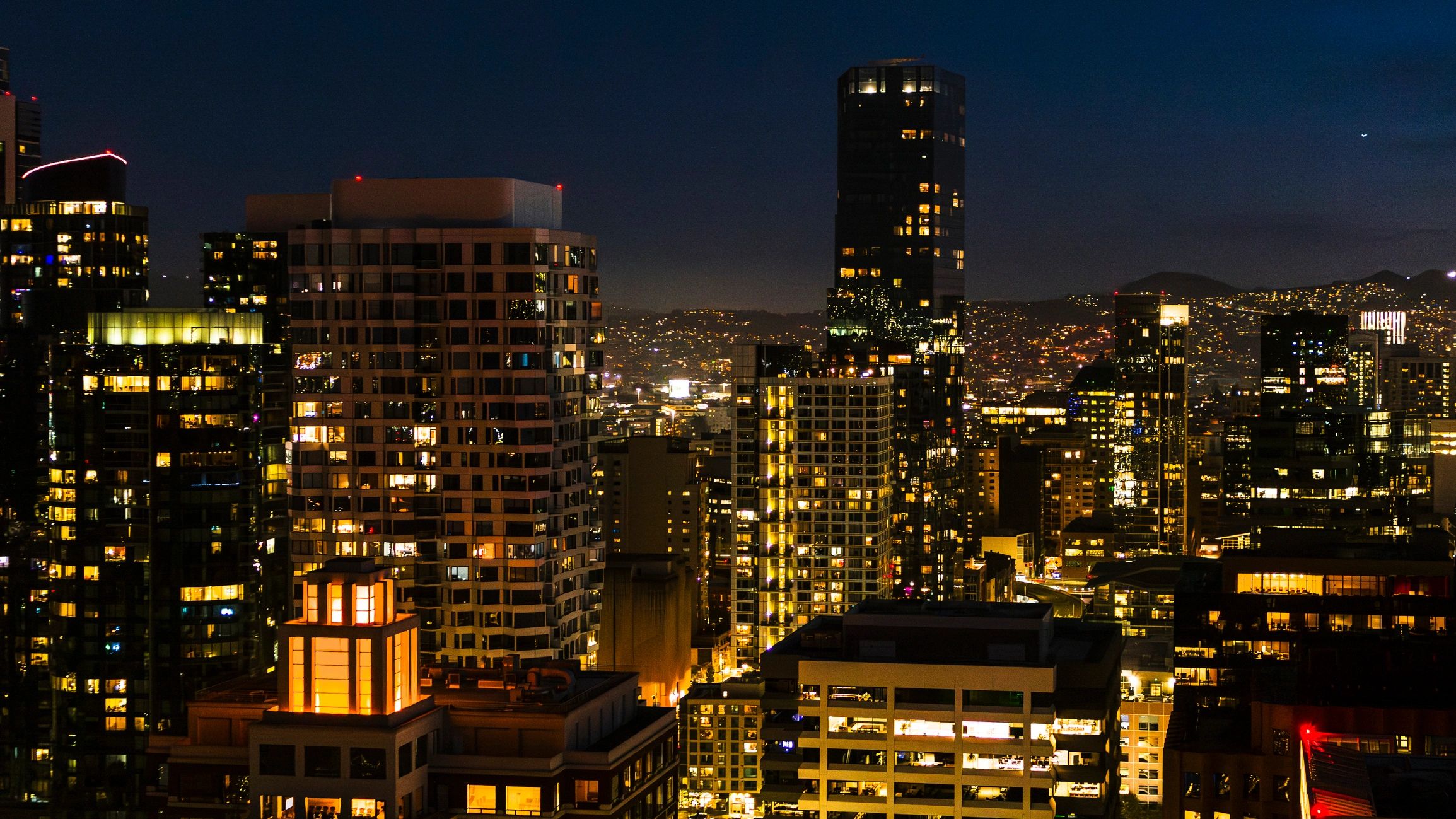 City skyline at night representing property investment