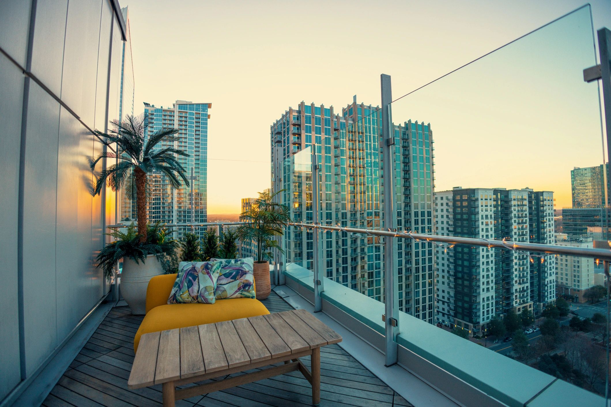 Luxury outdoor terrace with city view at sunset